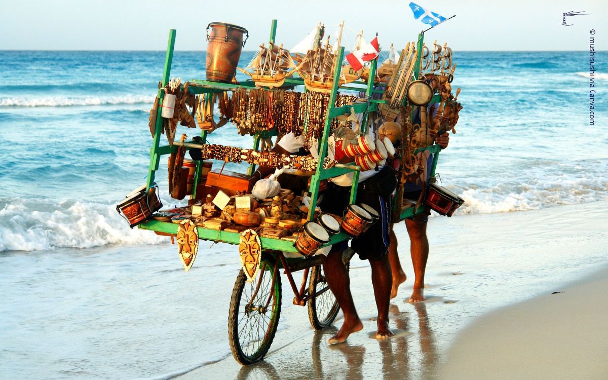 Ein Verk&auml;ufer schiebt sein Fahrrad mit einem &uuml;berf&uuml;llten Verkaufsgestell am menschenleeren Strand entlang. Das ild steht symbolisch daf&uuml;r, dass ein Bauchladen als Onlinebusiness-Modell ungeeignet ist.